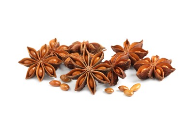 Photo of Dry anise stars with seeds on white background