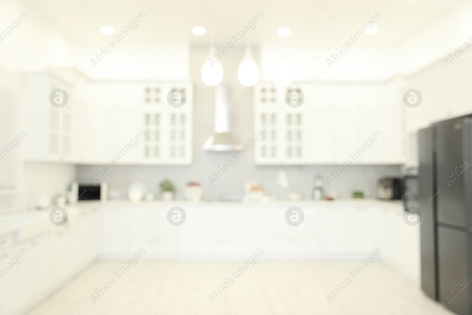 Photo of Blurred view of modern kitchen. Interior design