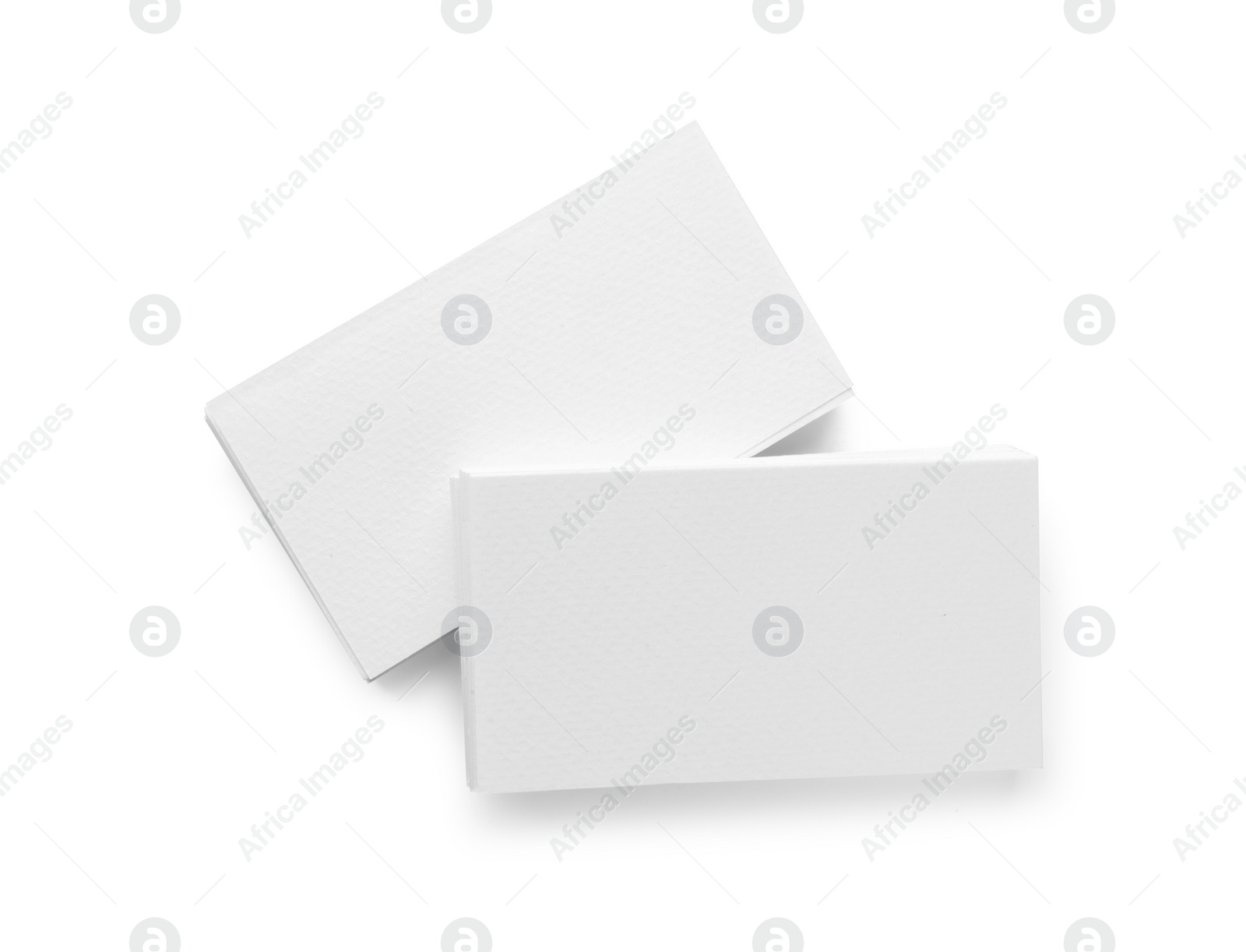 Photo of Blank business cards isolated on white, top view. Mockup for design