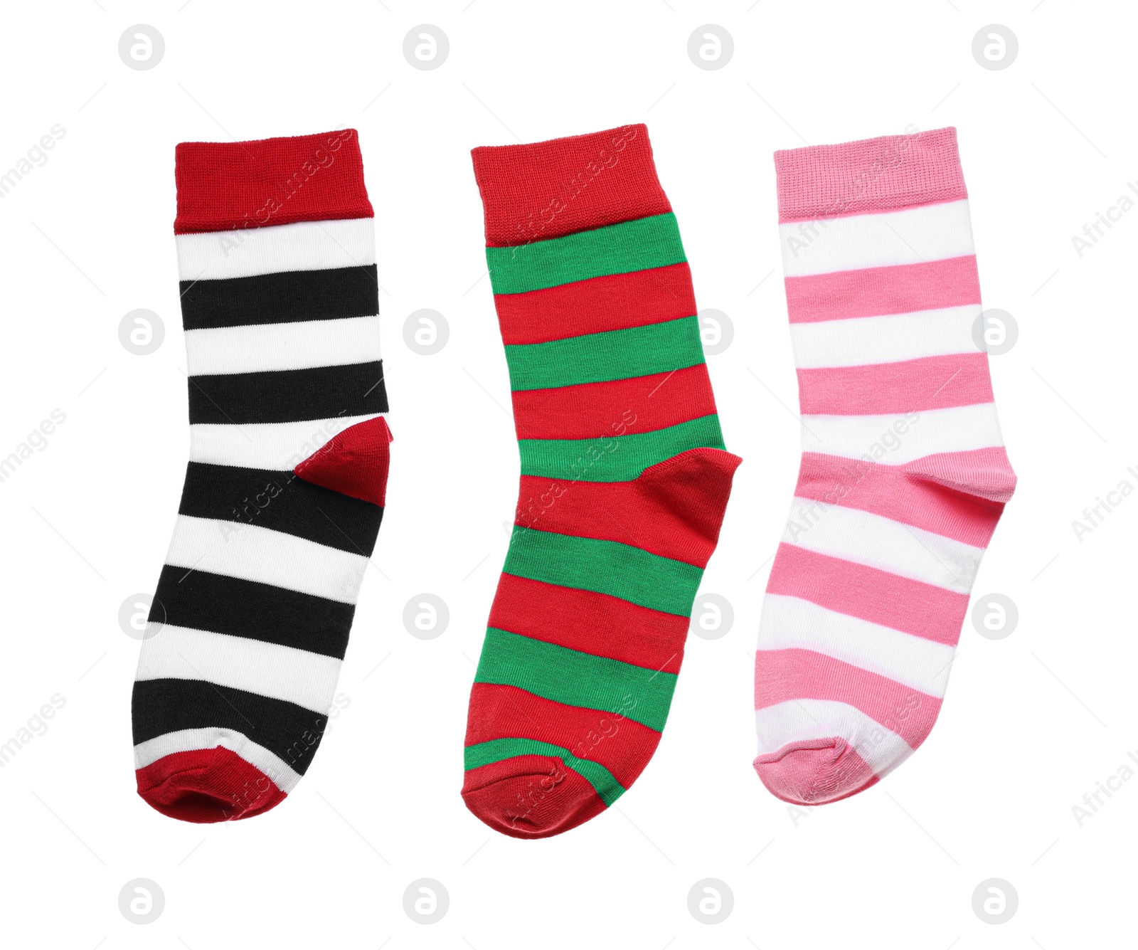 Photo of Different striped socks on white background, top view