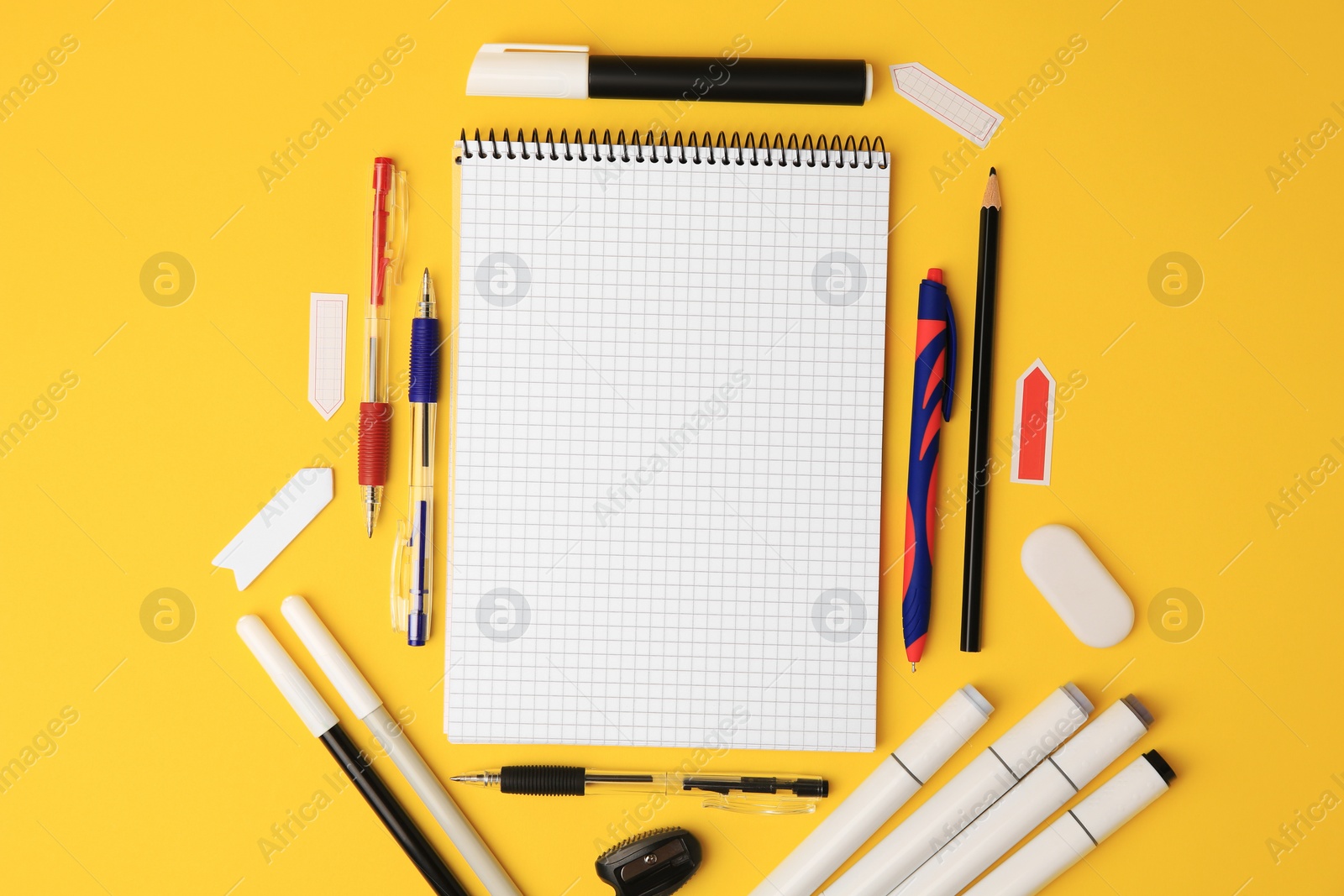 Photo of Different school stationery on yellow background, flat lay with space for text. Back to school