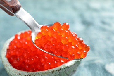 Spoon with delicious red caviar, closeup