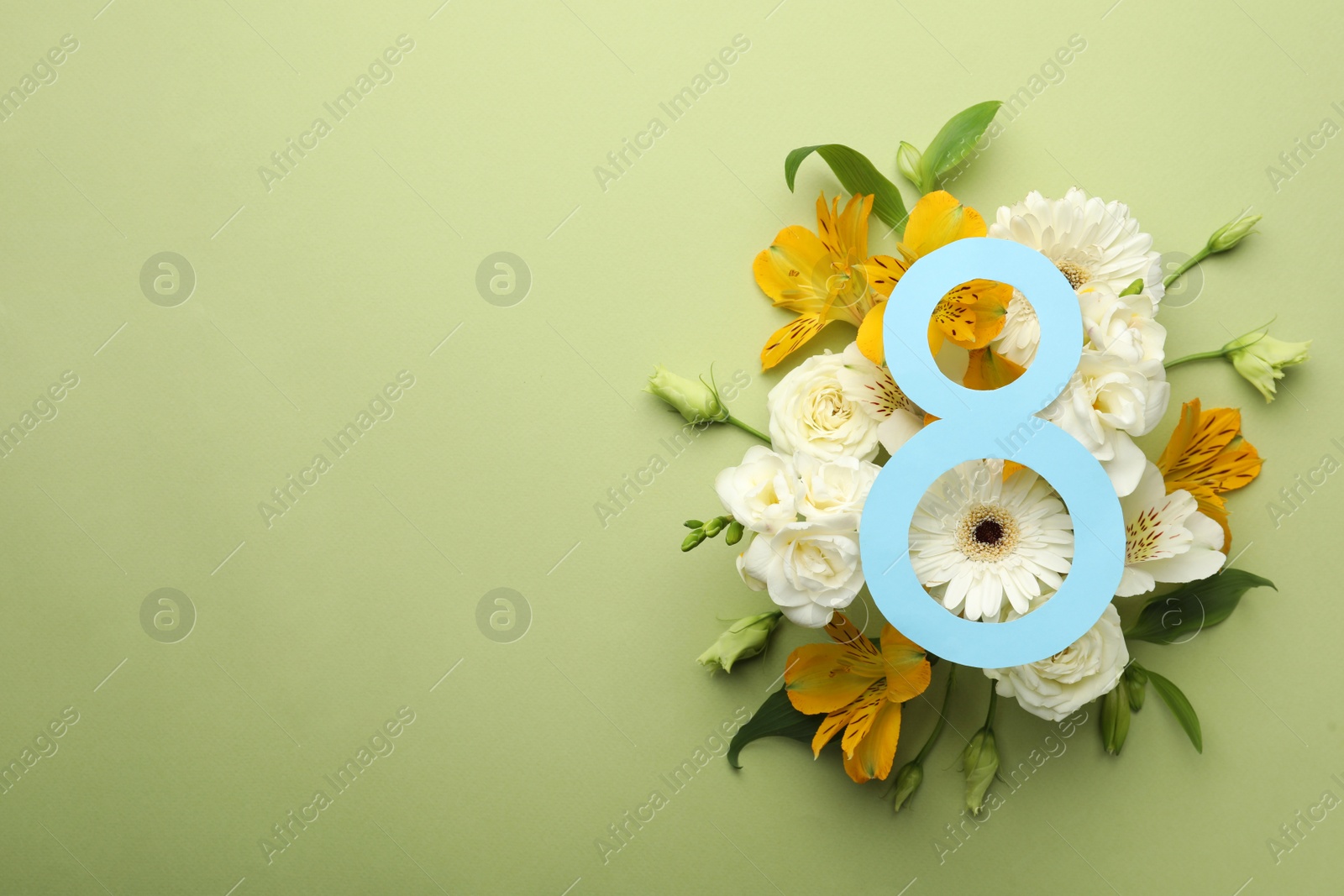 Photo of 8 March greeting card design with beautiful flowers on green background, flat lay and space for text. International Women's day