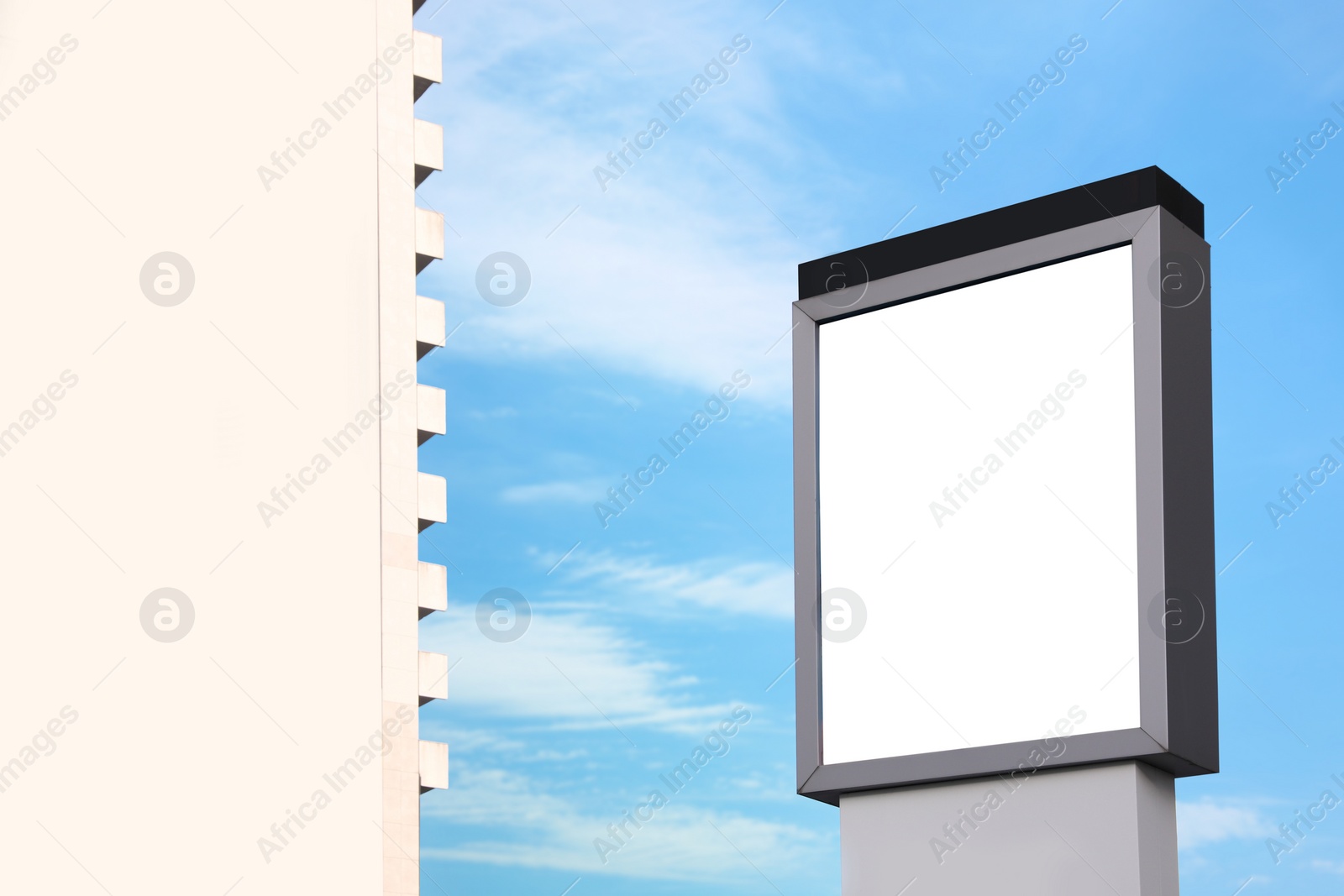 Image of Empty signboard against blue sky. Mock-up for design