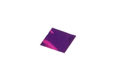 Piece of purple confetti isolated on white