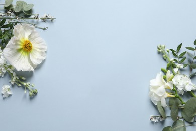 Photo of Different beautiful flowers on light grey background, flat lay. Space for text