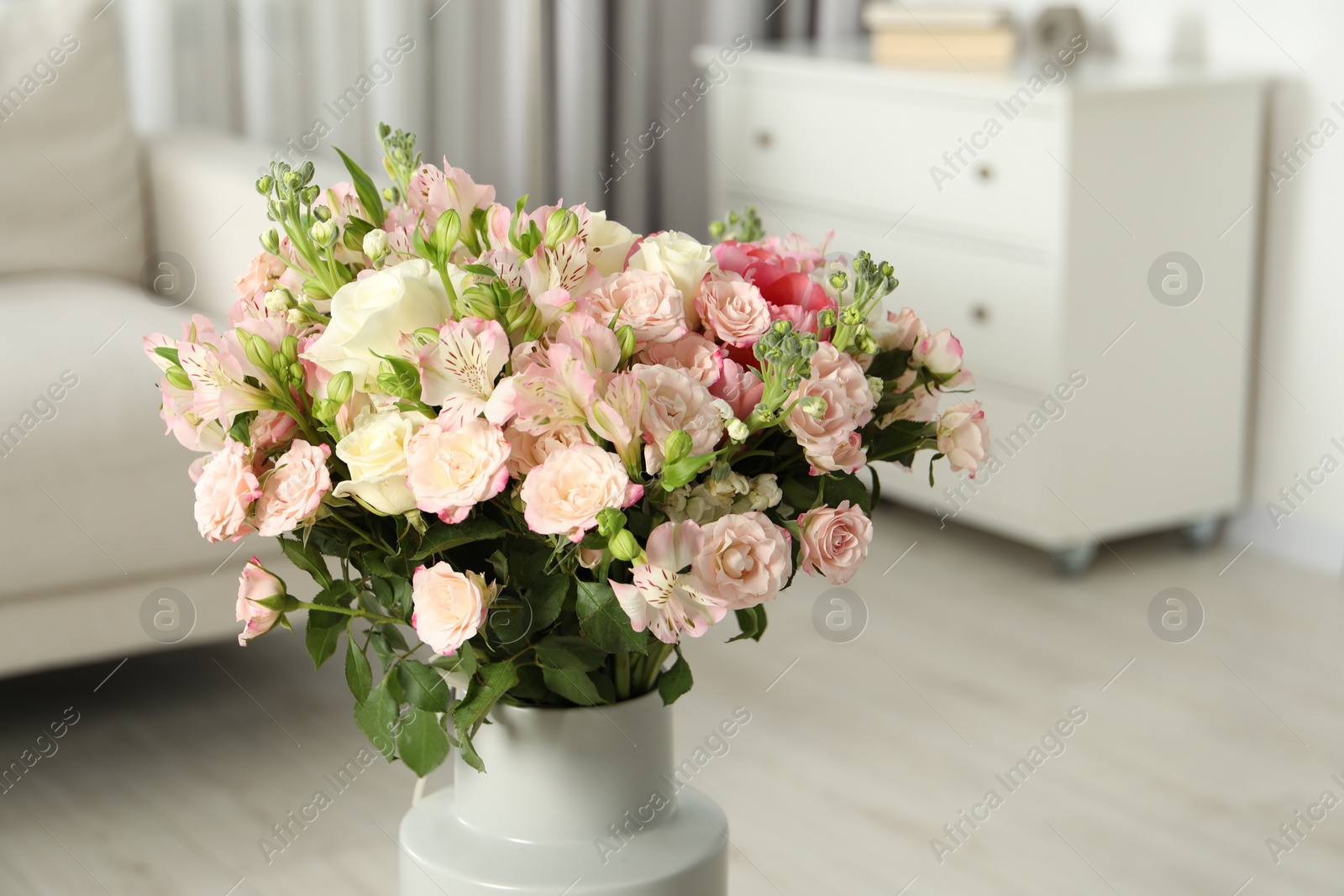 Photo of Beautiful bouquet of fresh flowers in vase indoors, space for text