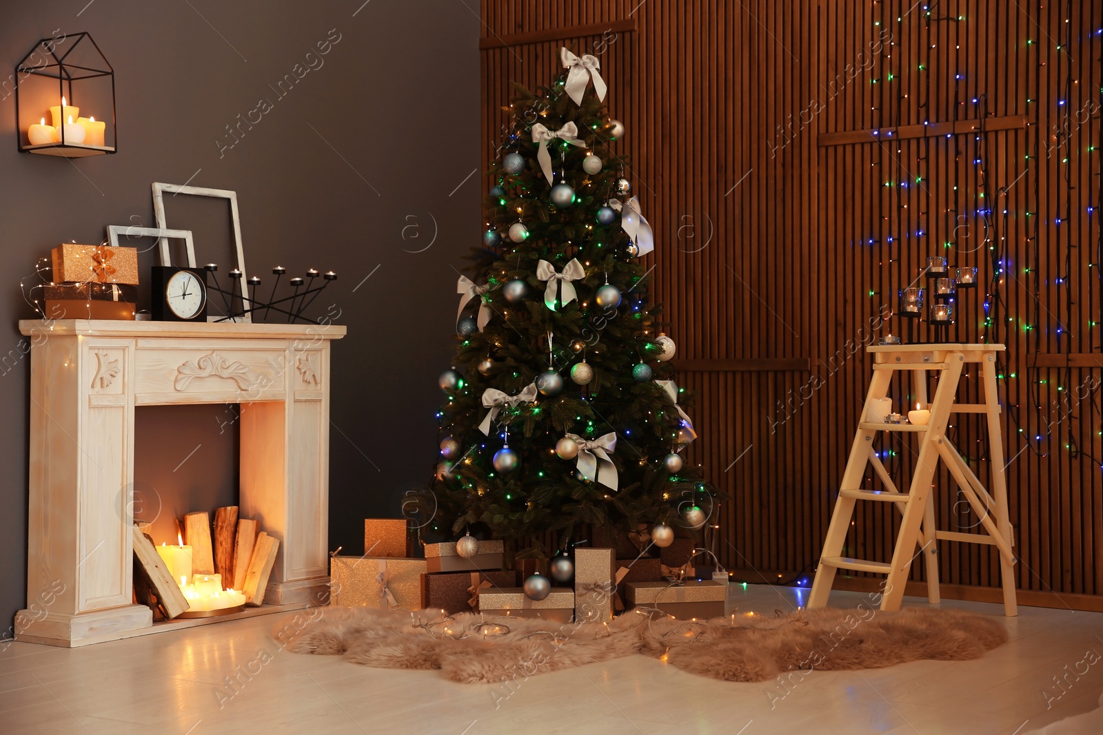 Photo of Stylish room interior with Christmas tree and decorative fireplace