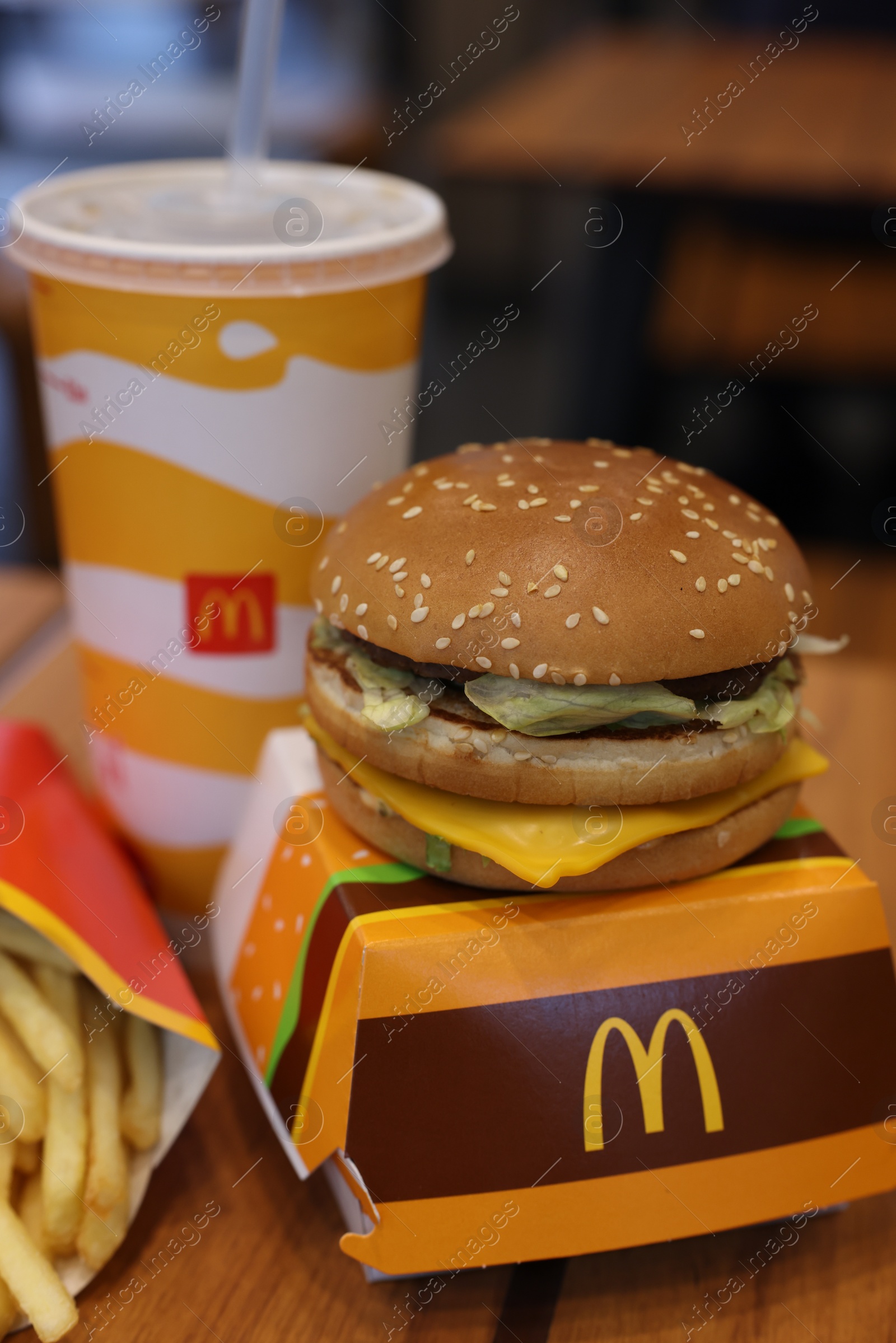 Photo of Lviv, Ukraine - October 9, 2023: McDonald's menu on wooden table in restaurant