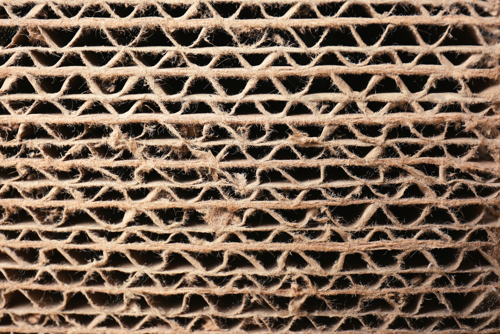 Photo of Closeup view of corrugated cardboard sheets. Recyclable packaging material