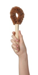 Woman holding eco friendly brush for dish washing on white background, closeup. Conscious consumption