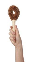 Photo of Woman holding eco friendly brush for dish washing on white background, closeup. Conscious consumption