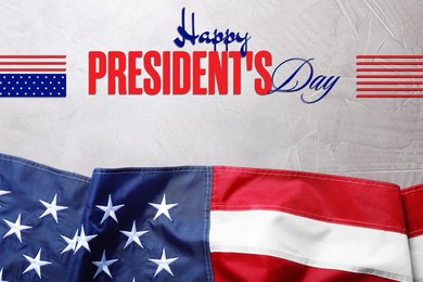 Image of Happy President's Day - federal holiday. American flag and text on stone background, top view