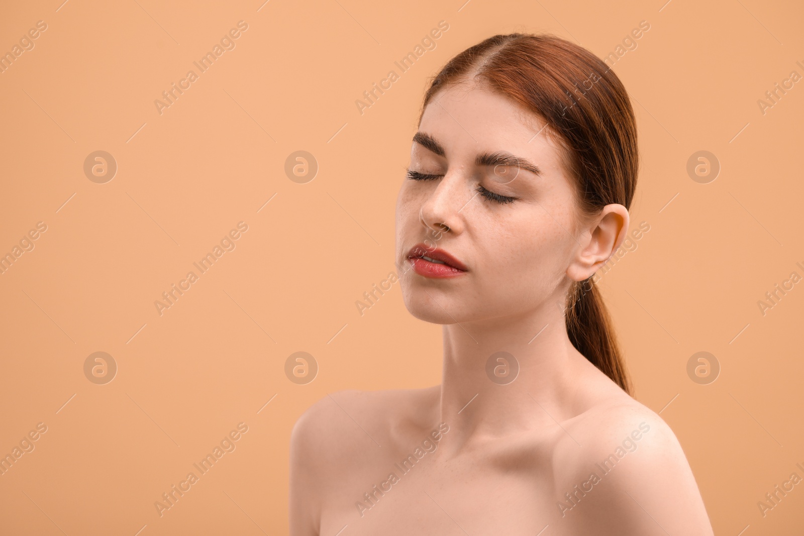 Photo of Portrait of beautiful woman on beige background. Space for text