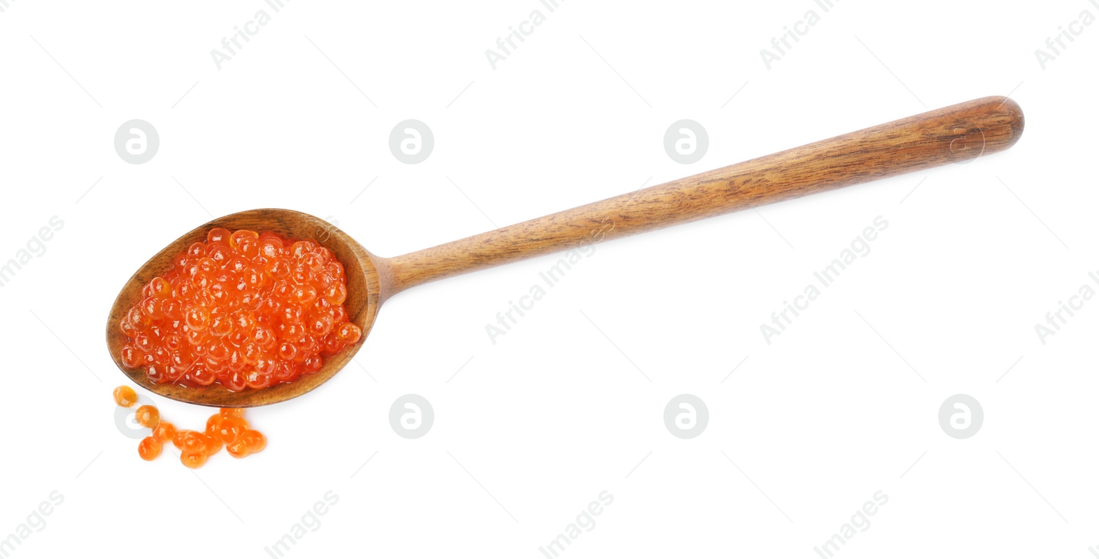 Photo of Wooden spoon and delicious red caviar isolated on white, top view