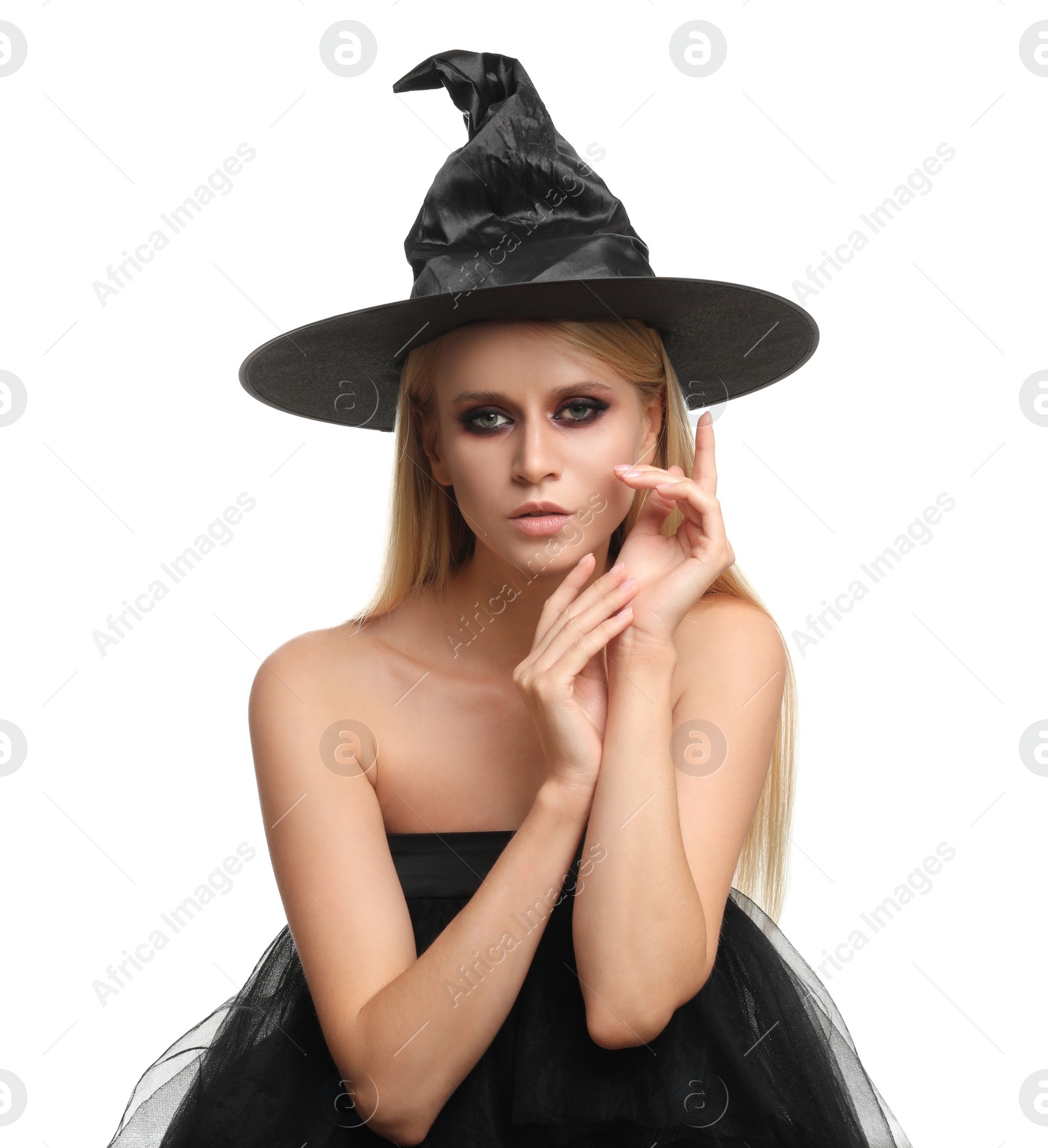 Photo of Witch in black hat isolated on white. Scary fantasy character