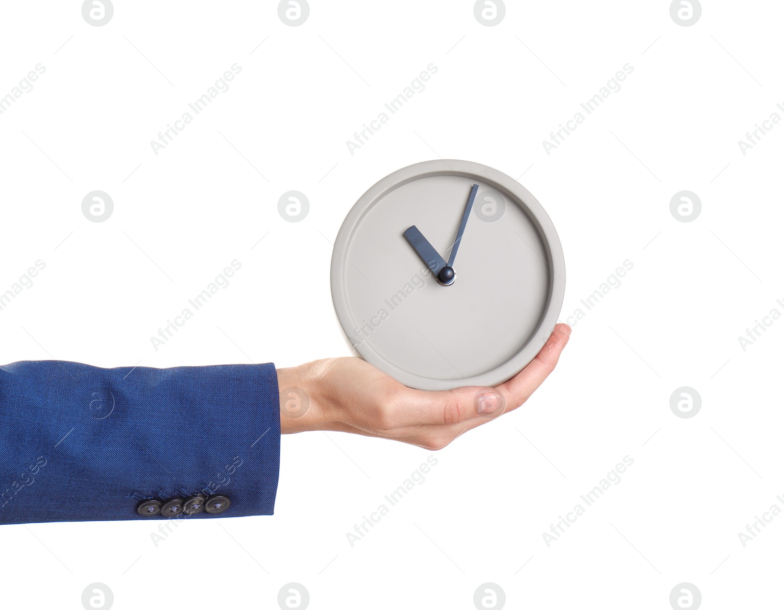 Photo of Young businesswoman holding clock on white background. Time management