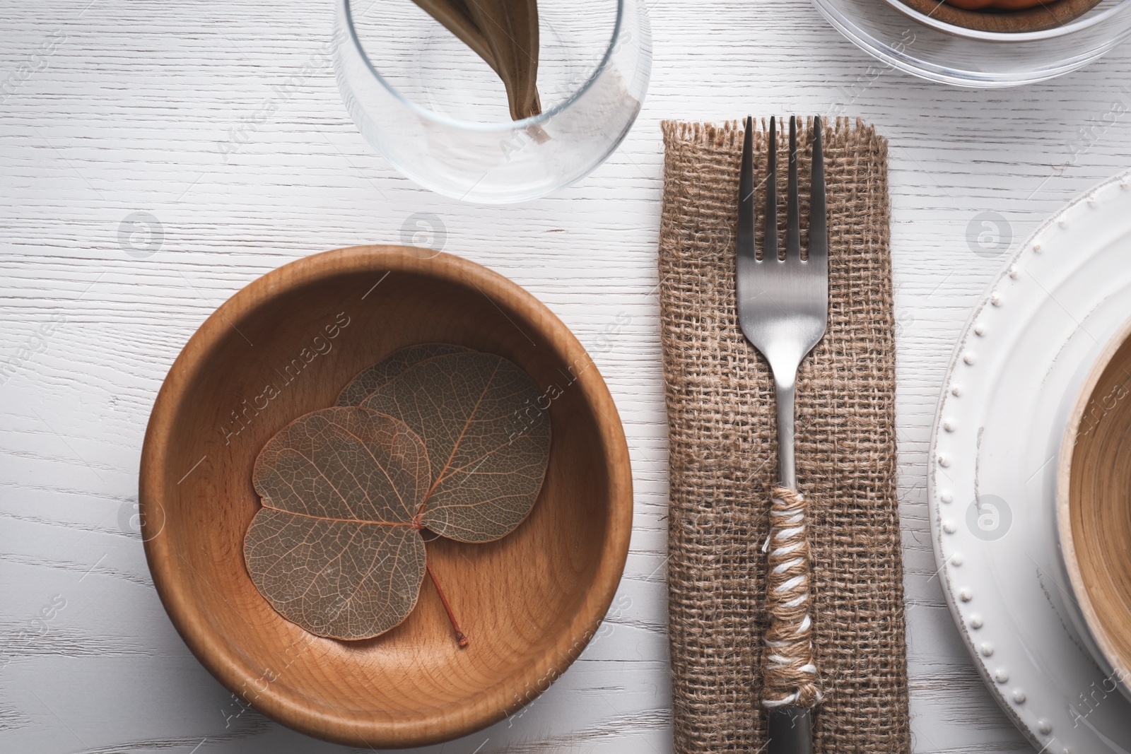 Photo of Autumn table setting on white wooden background, flat lay