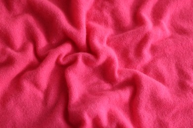 Beautiful pink fabric as background, top view