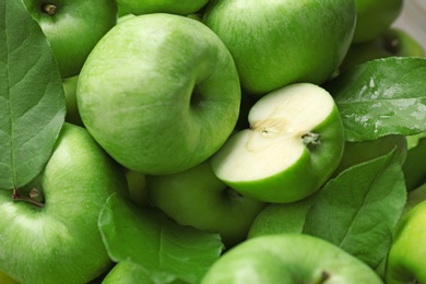 Fresh green apples as background