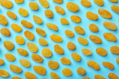 Flat lay composition with raisins on color background. Dried fruit as healthy snack