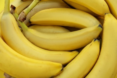 Many tasty bananas as background, closeup view