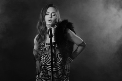 Image of Beautiful singer with microphone, black and white effect