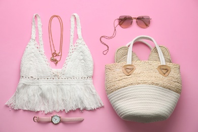 Photo of Flat lay composition with woman's straw bag on pink background