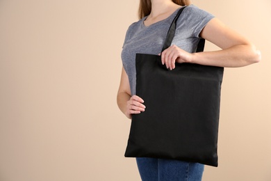 Photo of Woman with eco bag on color background. Mock up for design