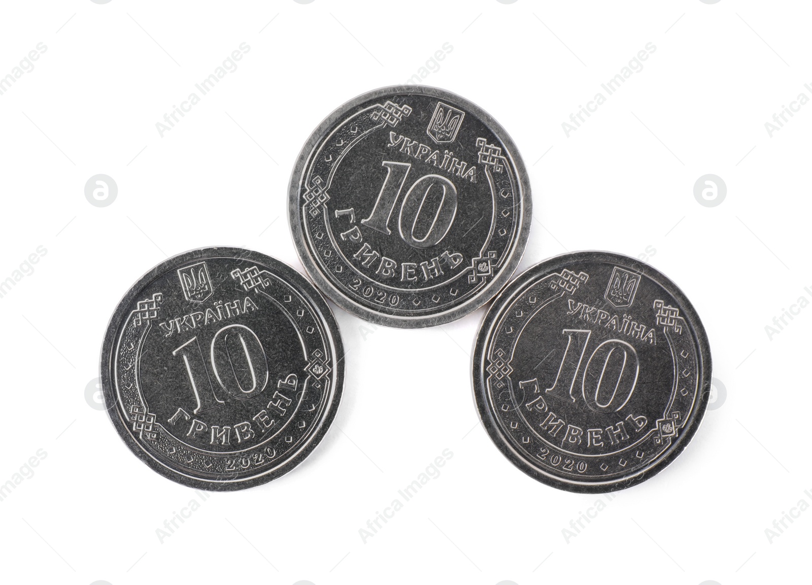 Photo of Ukrainian coins isolated on white, top view. National currency