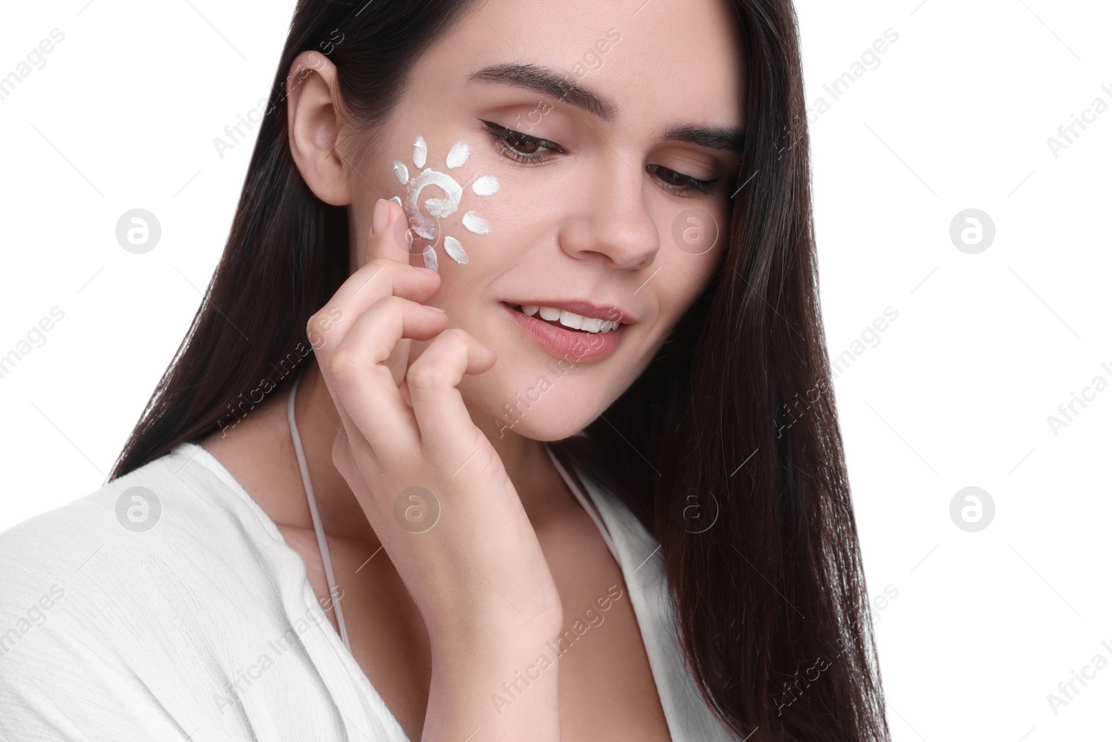 Photo of Beautiful young woman with sun protection cream on her face against white background