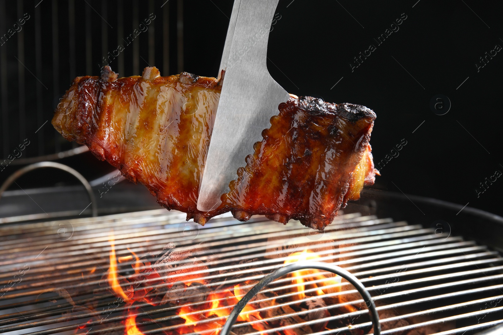 Image of Delicious ribs on barbecue grill. Yummy meat