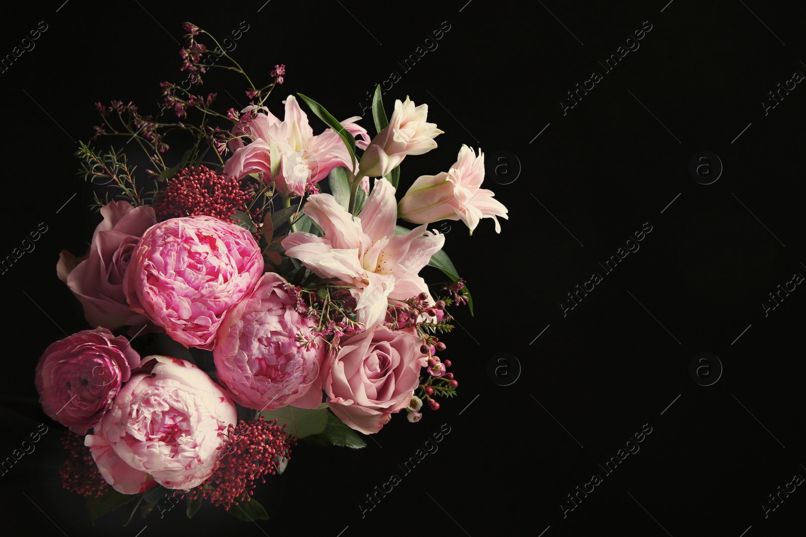 Photo of Beautiful bouquet of different flowers on black background. Floral card design with dark vintage effect