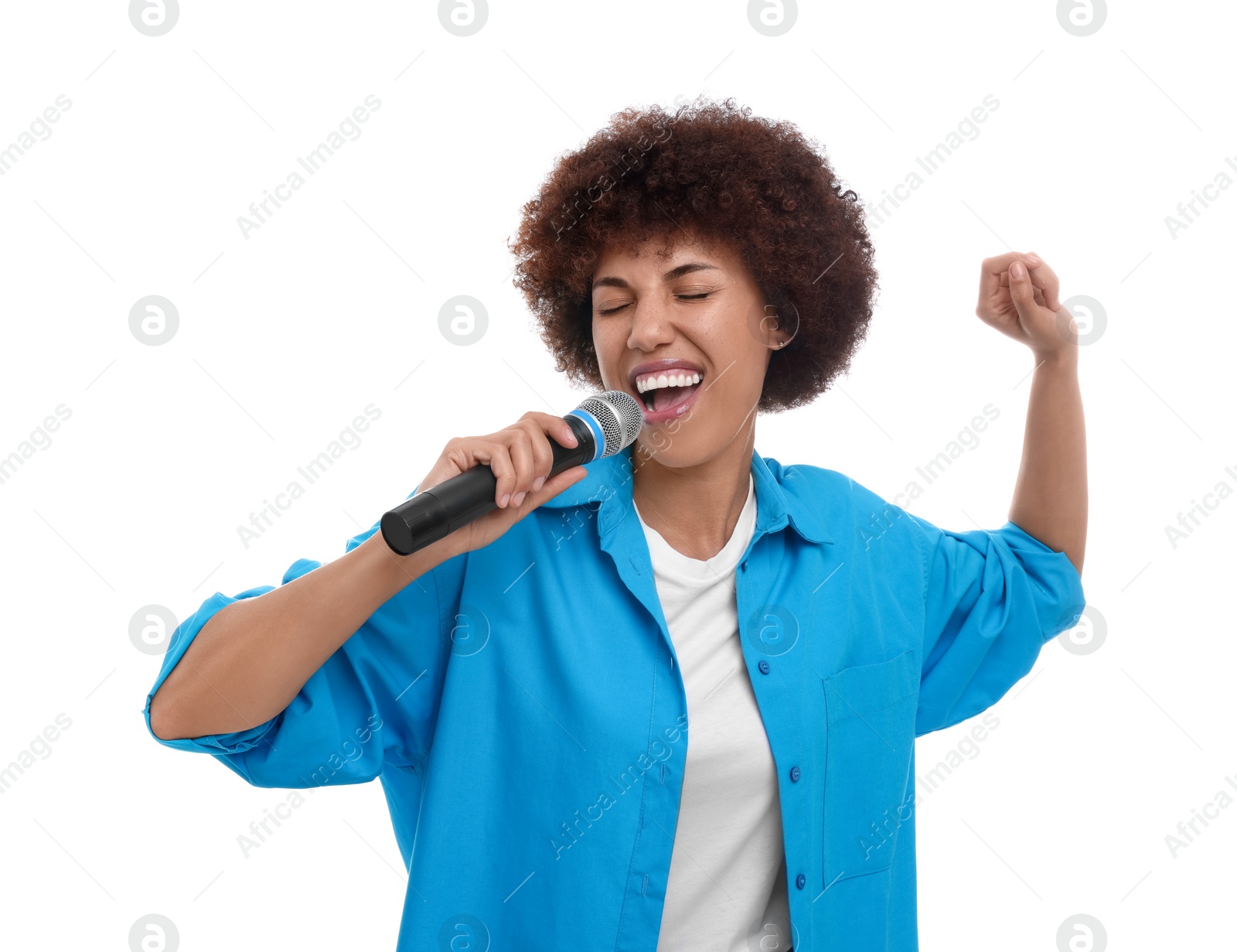 Photo of Curly young woman with microphone singing on white background