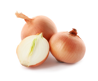 Whole and cut onion bulbs on white background