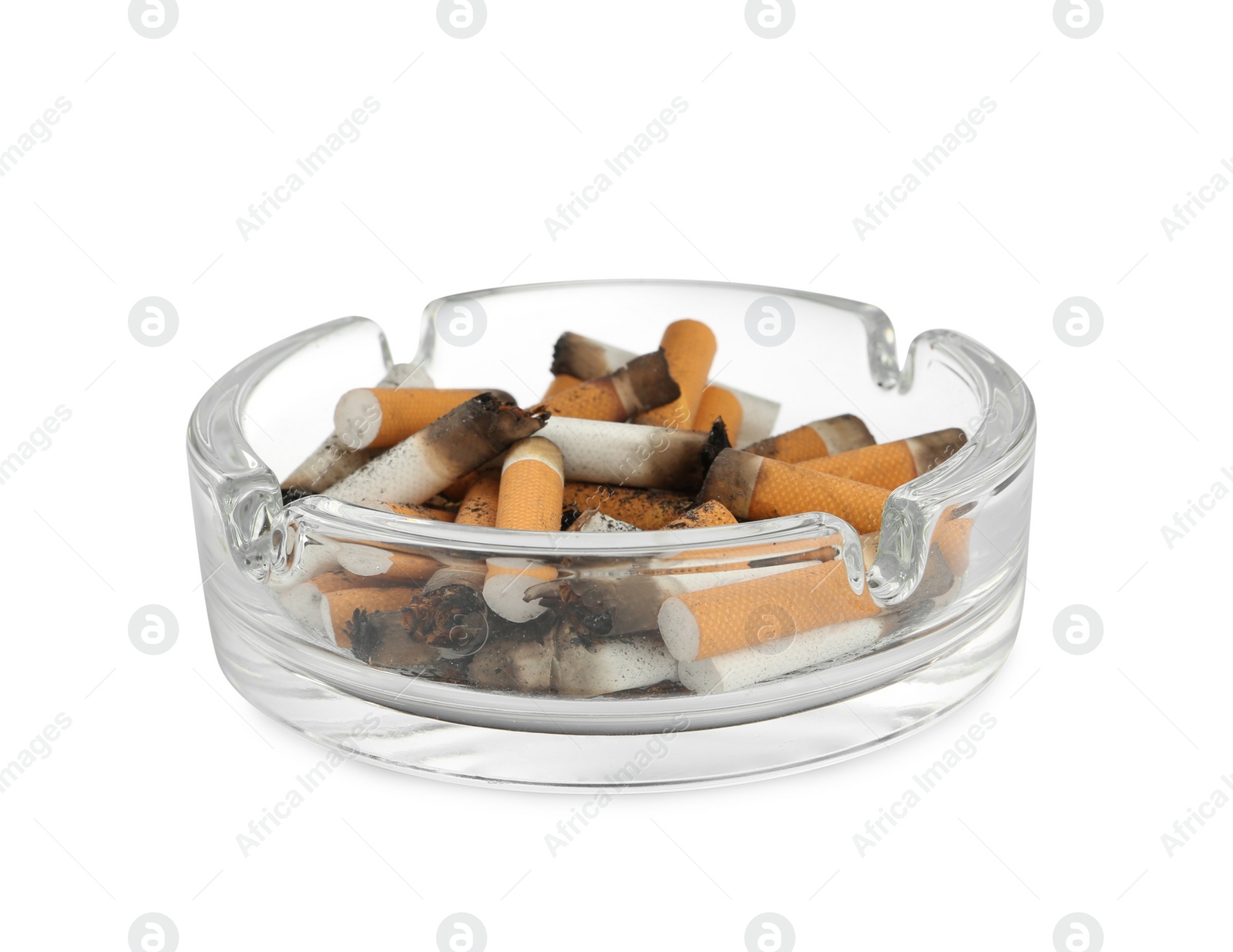 Photo of Glass ashtray with cigarette stubs isolated on white