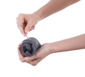 Photo of Woman needle felting from wool on white background, closeup