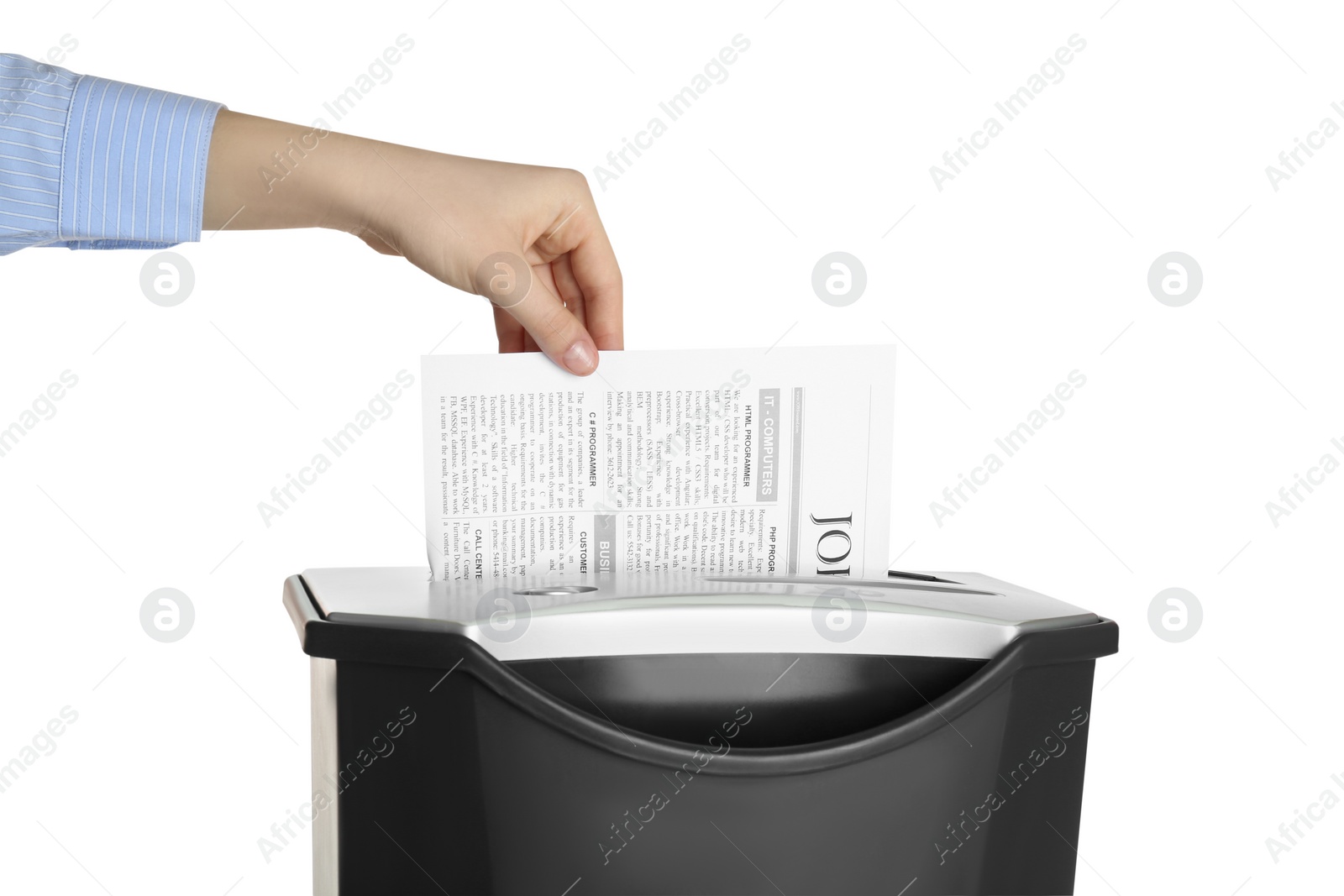 Photo of Woman destroying newspaper with paper shredder on white background, closeup