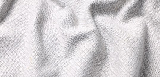 Texture of white crumpled fabric as background, closeup