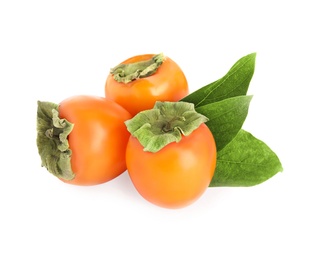 Photo of Delicious persimmons and green leaves isolated on white