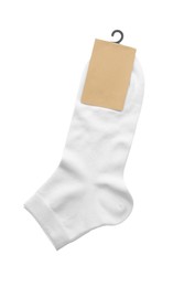 New pair of cotton socks on white background, top view