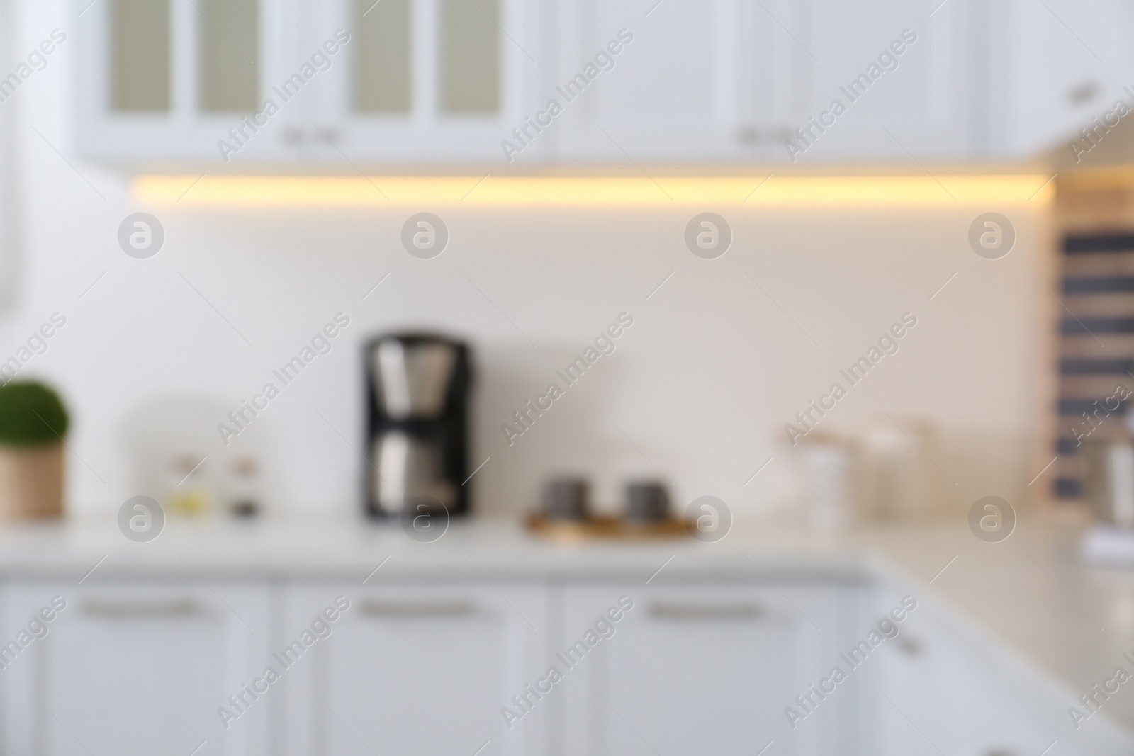 Photo of Blurred view of modern stylish kitchen interior