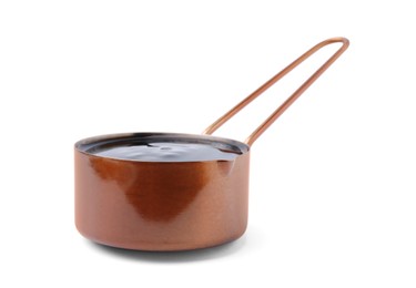 Photo of Metal small saucepan with balsamic glaze on white background