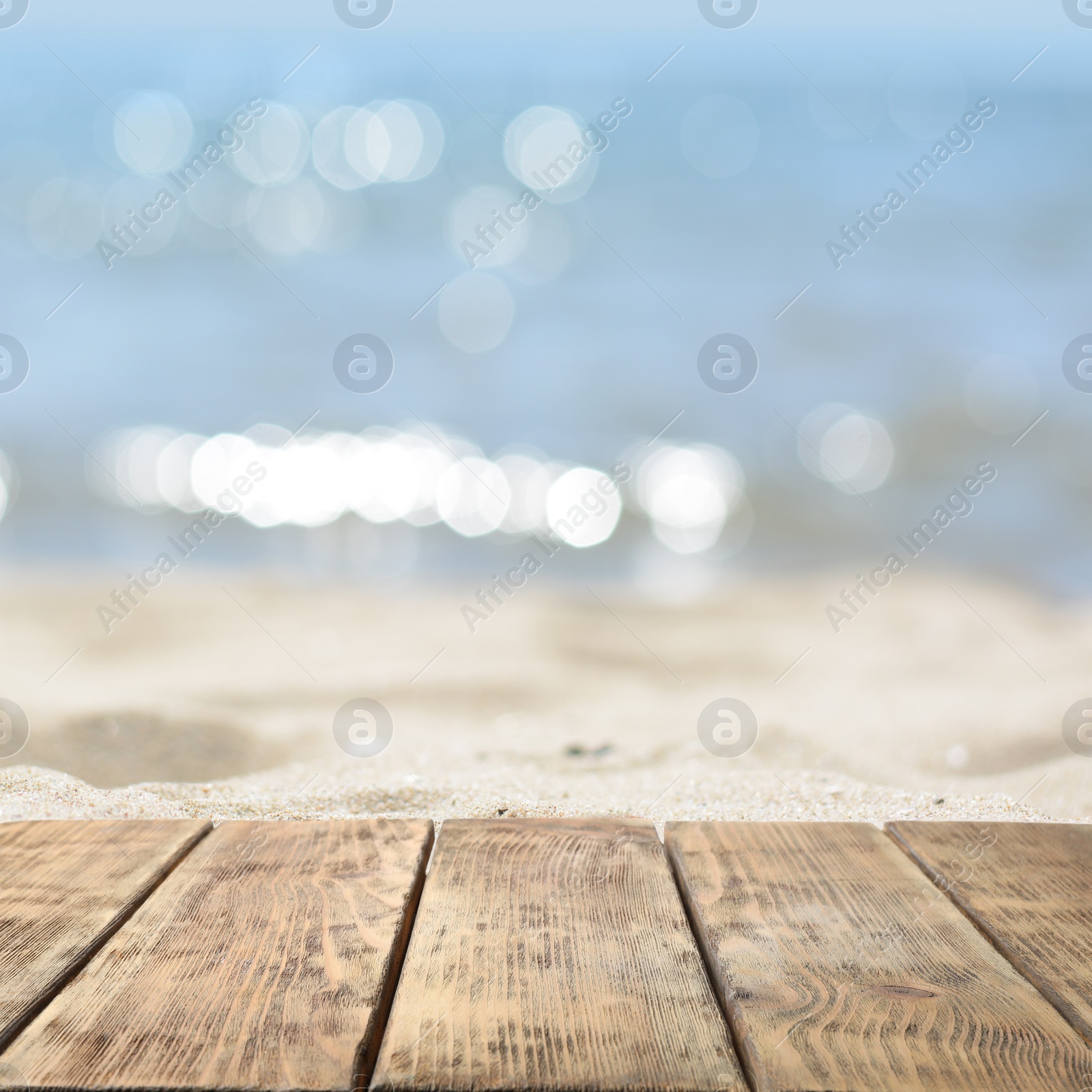 Image of Empty wooden surface on beach near sea. Summer season