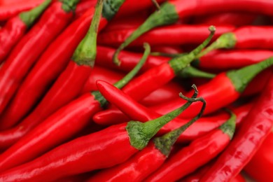 Red hot chili peppers as background, closeup