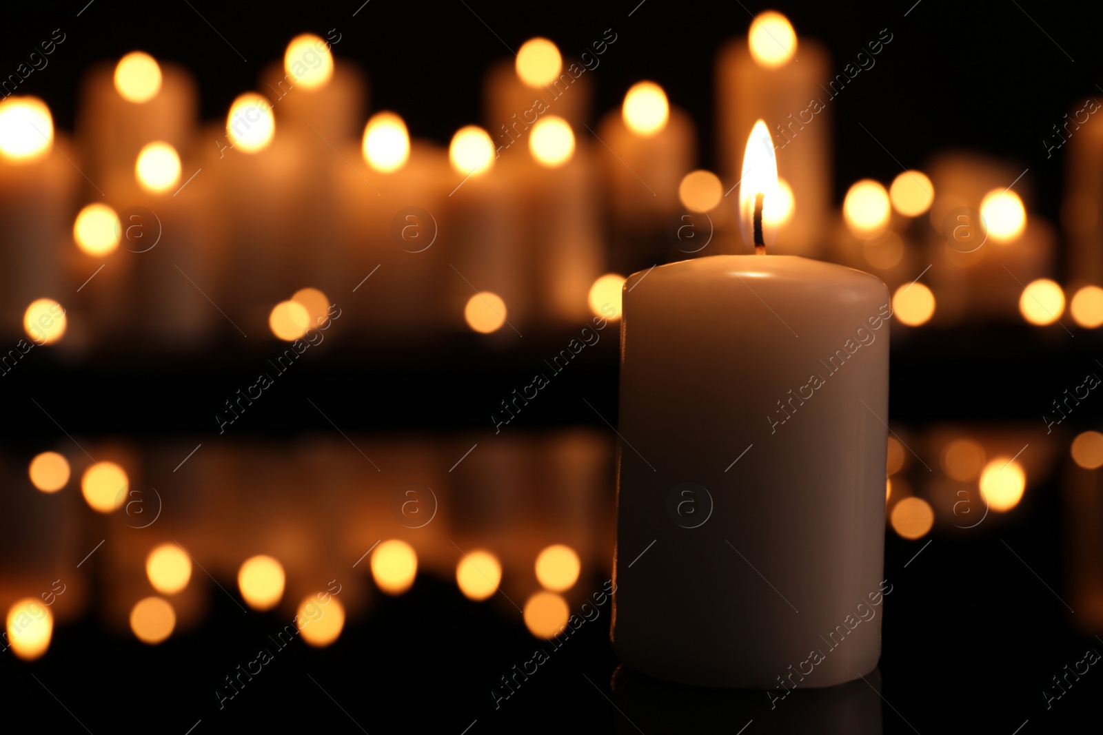 Photo of Burning candle in darkness, space for text. Memory day