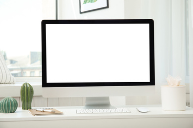 Photo of Comfortable workplace with modern computer on table