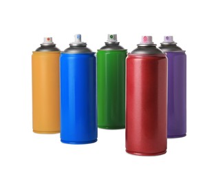 Photo of Cans of different spray paints on white background. Graffiti supplies