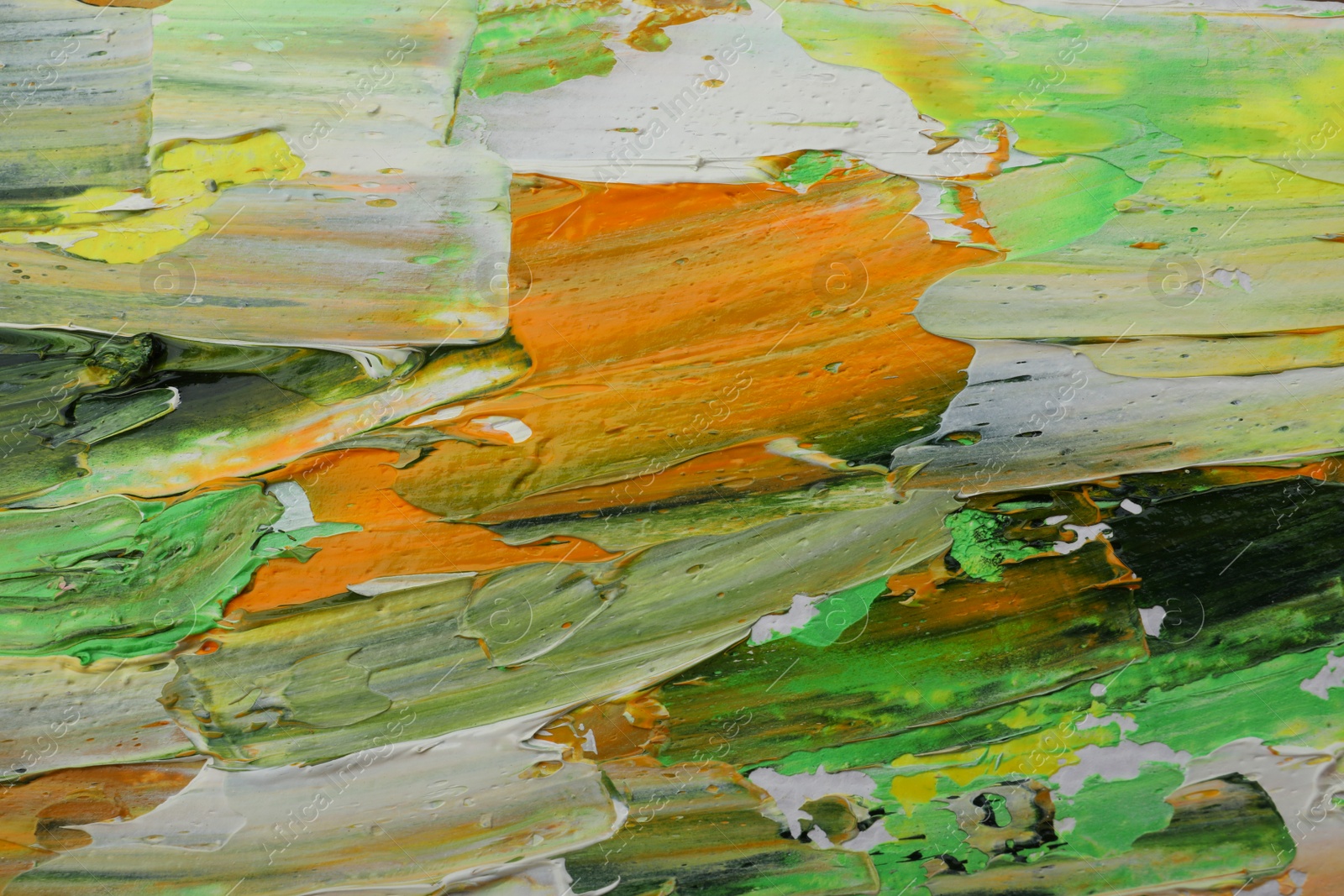 Photo of Beautiful strokes of colorful oil paints as background, closeup