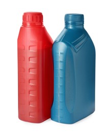Photo of Plastic bottles with liquids on white background